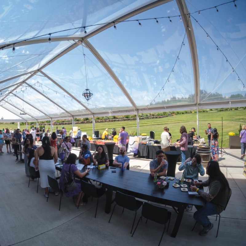 People enjoying the Oregon AAPI Food & Wine Fest outside at Stoller's Experience Center.